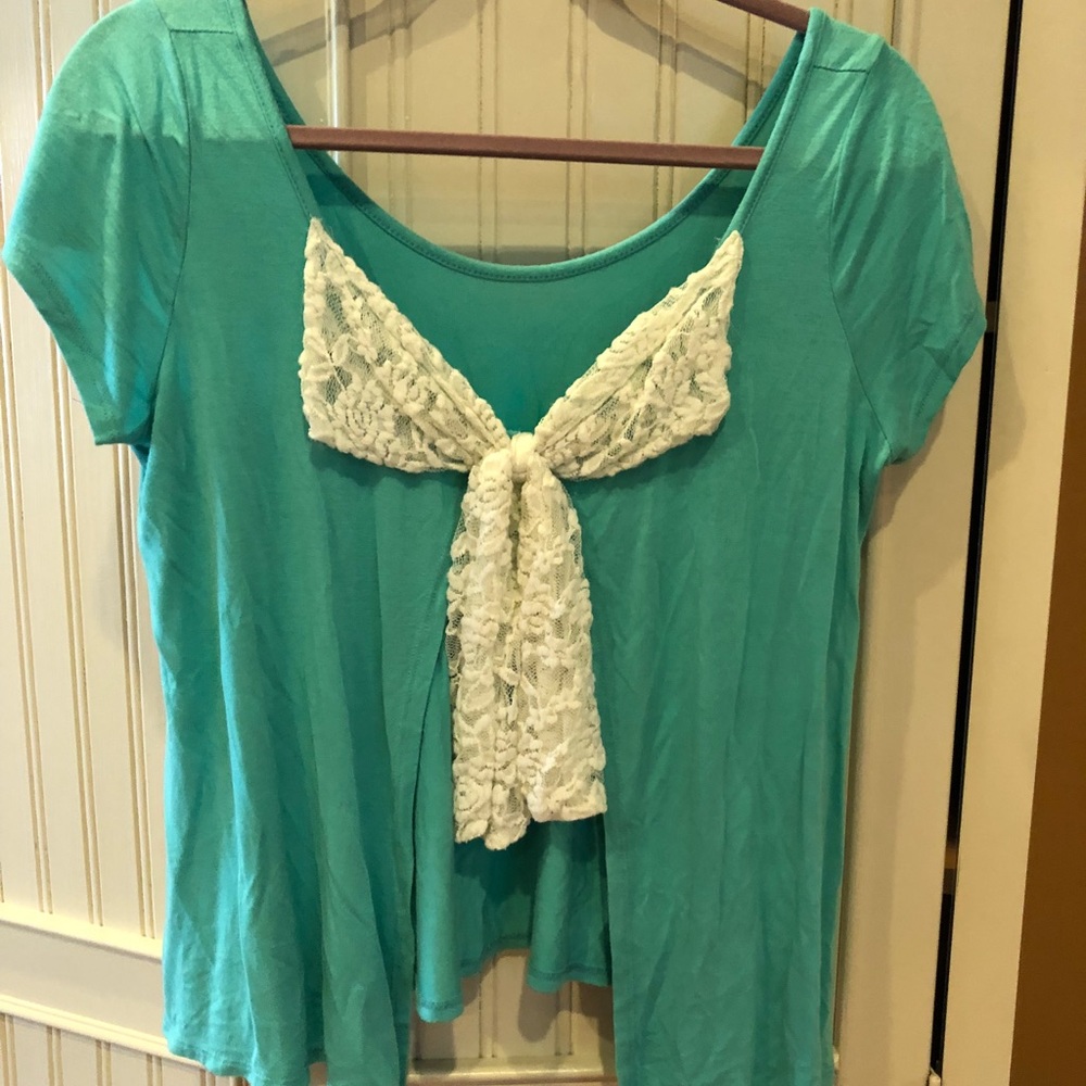 Teal top, white bow in the back.